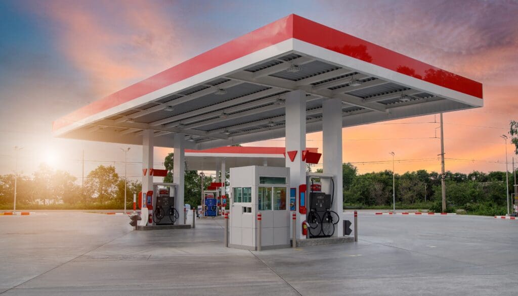 A gas station with a red and white canopy.