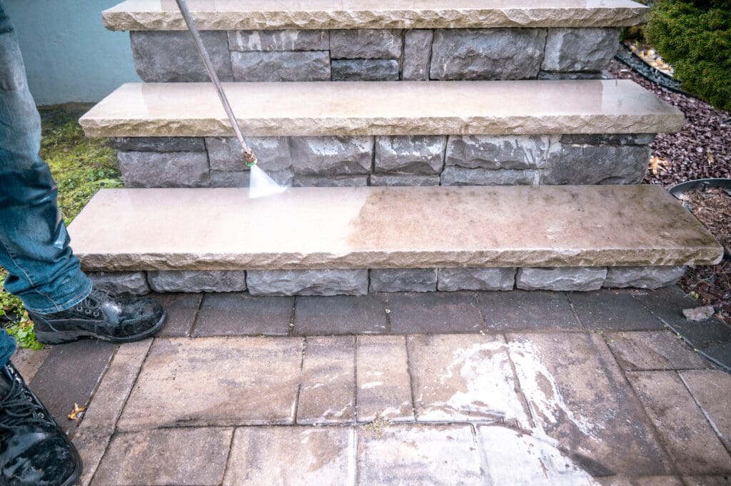 A stair case with some steps and a water hose